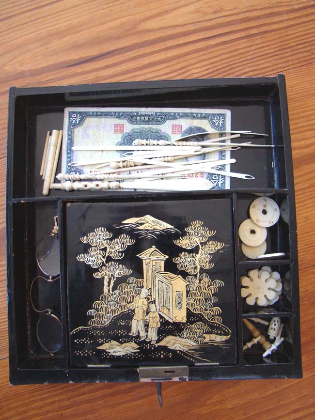 A fine large 19th century Chinese black and gold lacquer sewing box loaded with the original period accessories — image 8